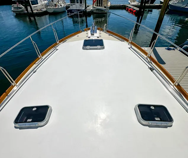 On-rush Yacht Photos Pics Bow deck of a 2000 Grand Banks Eastbay 43 Ex yacht at a marina.