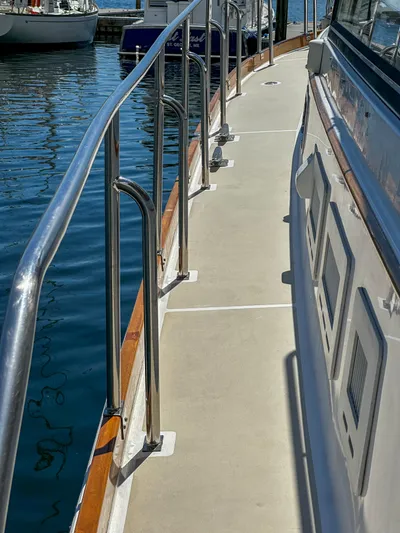 On-rush Yacht Photos Pics 2000 Grand Banks Eastbay 43 Ex yacht deck with stainless steel railings at marina.