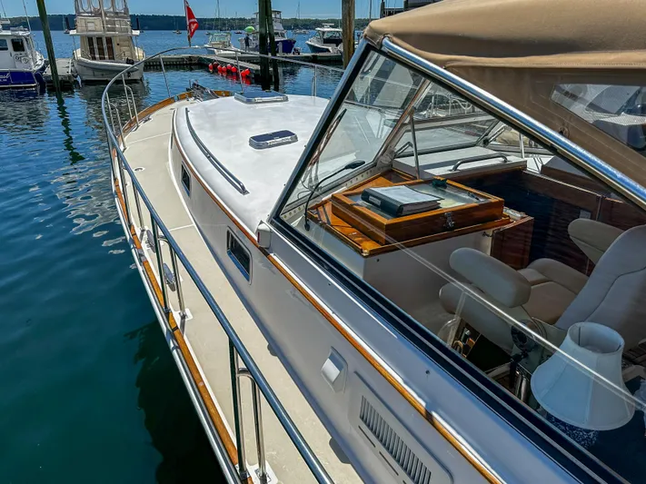 On-rush Yacht Photos Pics 2000 Grand Banks Eastbay 43 Ex yacht docked at marina, side view.