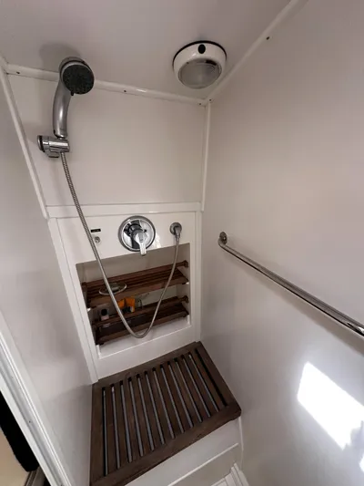 On-rush Yacht Photos Pics Shower area in 2000 Grand Banks Eastbay 43 Ex yacht with wooden floor grate.