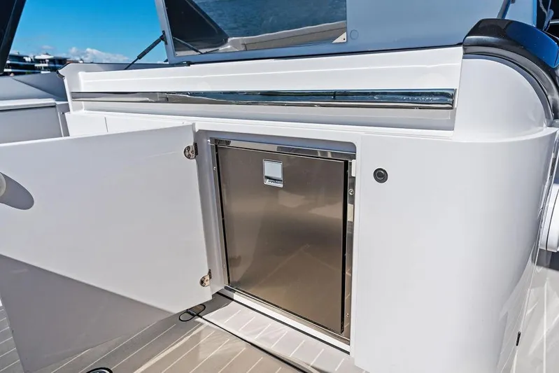  Yacht Photos Pics 2024 Azimut Verve 42 yacht with open storage compartment and stainless steel door.