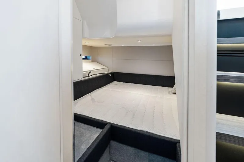  Yacht Photos Pics Interior cabin of 2024 Azimut Verve 42 yacht, featuring a cozy bed and modern design.