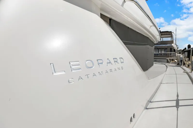 Prelude Yacht Photos Pics 2024 Leopard 46 Powercat catamaran with sleek design and branding.