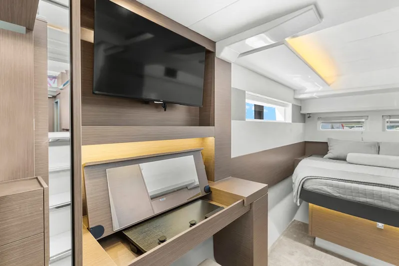 Prelude Yacht Photos Pics Luxurious interior of 2024 Leopard 46 Powercat with modern bedroom and entertainment setup.