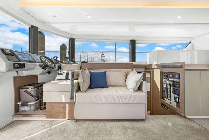 Prelude Yacht Photos Pics Luxurious interior of 2024 Leopard 46 Powercat with modern helm and comfortable seating.