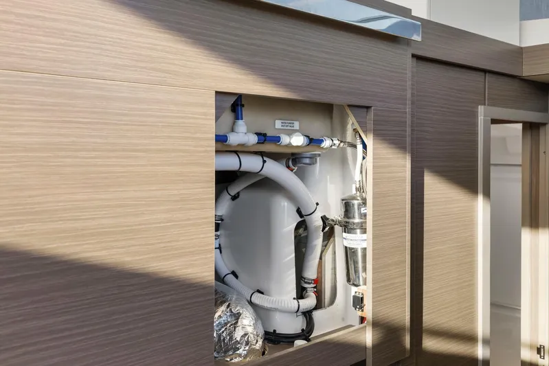 Prelude Yacht Photos Pics Interior plumbing system of 2024 Leopard 46 Powercat yacht, showcasing pipes and fittings.