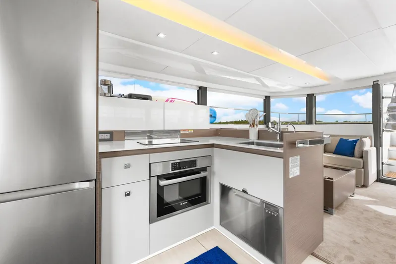 Prelude Yacht Photos Pics Modern kitchen interior on 2024 Leopard 46 Powercat yacht with sleek appliances and panoramic windows.