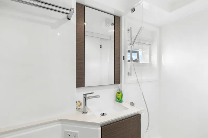 Prelude Yacht Photos Pics Modern bathroom in 2024 Leopard 46 Powercat yacht with sleek fixtures and mirror.