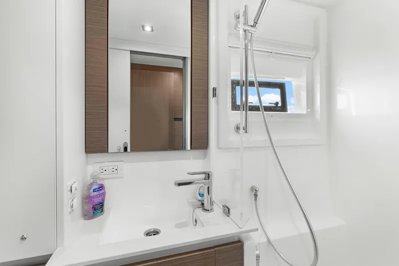 Prelude Yacht Photos Pics Modern bathroom in 2024 Leopard 46 Powercat yacht with sleek fixtures and window.