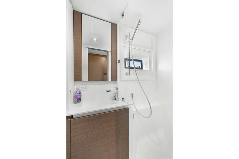 Prelude Yacht Photos Pics Modern bathroom in 2024 Leopard 46 Powercat yacht with sleek fixtures and wood accents.