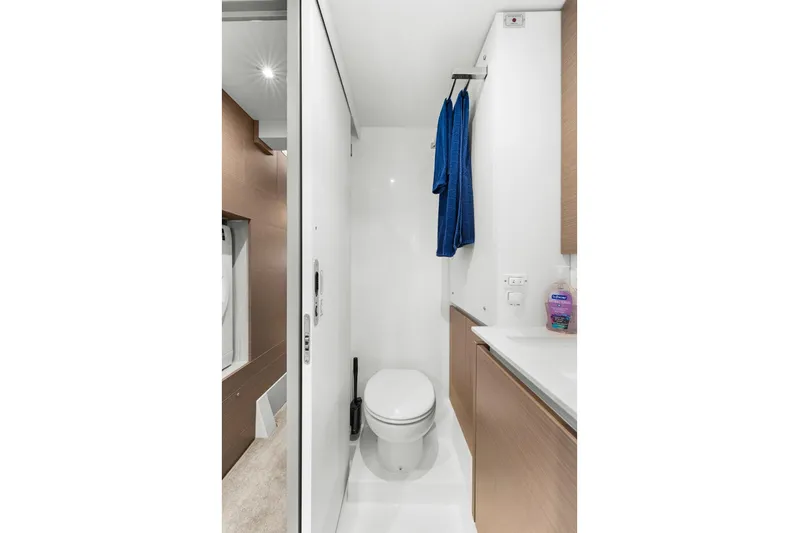 Prelude Yacht Photos Pics Modern bathroom in 2024 Leopard 46 Powercat yacht, featuring sleek design and compact amenities.