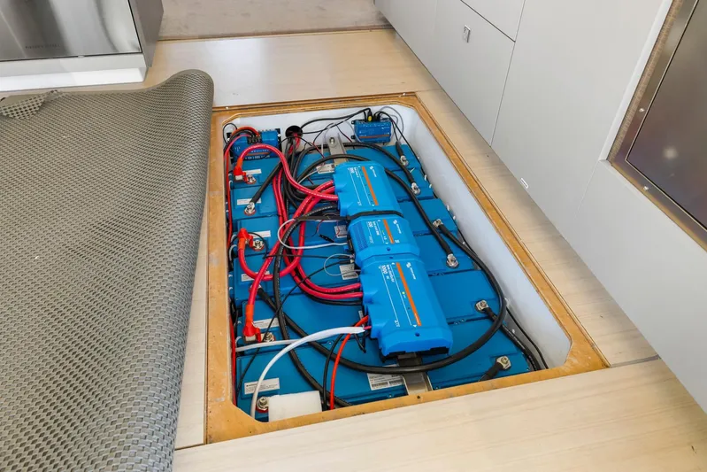 Prelude Yacht Photos Pics Electrical system of 2024 Leopard 46 Powercat, featuring batteries and wiring under floor panel.