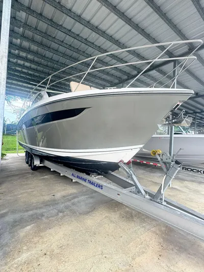  Yacht Photos Pics 2016 Pursuit SC 365i Sport Coupe on trailer in covered storage.