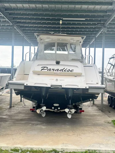  Yacht Photos Pics 2016 Pursuit SC 365i Sport Coupe boat named "Paradise" in covered storage.