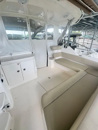  Yacht Photos Pics 2016 Pursuit SC 365i Sport Coupe interior with beige seating and white cabinetry.