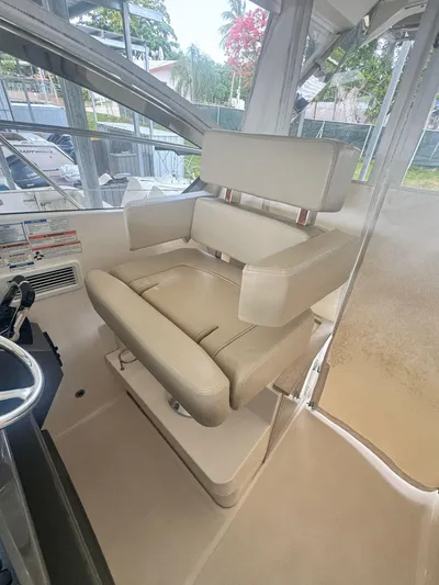  Yacht Photos Pics 2016 Pursuit SC 365i Sport Coupe interior with beige captain's chair.