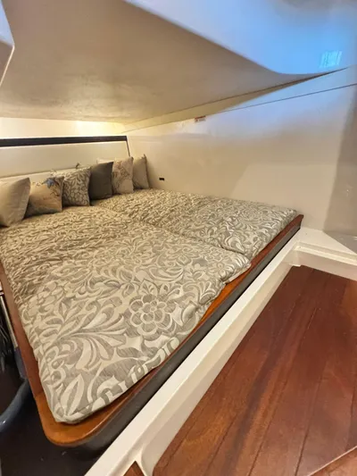  Yacht Photos Pics Luxurious cabin interior of 2016 Pursuit SC 365i Sport Coupe with elegant bedding.