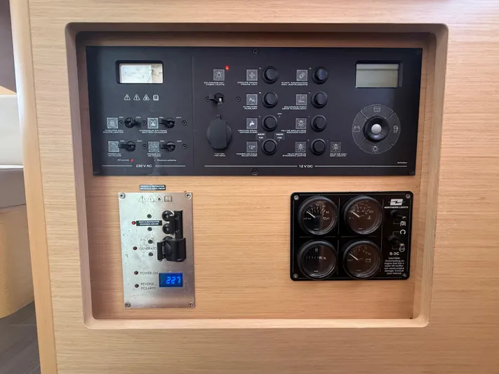 La Mer Yacht Photos Pics Control panel of a 2020 Lagoon 42 yacht, featuring various switches and gauges.