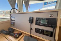 Control panel of a 2020 Lagoon 42 catamaran with navigation and communication equipment.