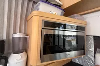 Modern kitchen in 2020 Lagoon 42 yacht with Whirlpool oven and Philips blender.