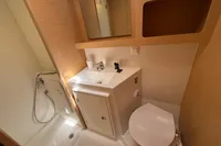 Modern bathroom in a 2020 Lagoon 42 yacht, featuring a shower, sink, and toilet.