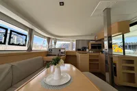 Interior of 2020 Lagoon 42 catamaran with modern kitchen and dining area.