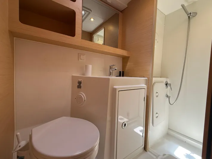 La Mer Yacht Photos Pics Bathroom interior of 2020 Lagoon 42 yacht with shower, sink, and toilet.