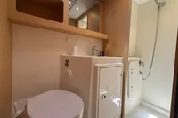 Bathroom interior of 2020 Lagoon 42 yacht with shower, sink, and toilet.