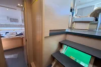 Interior of 2020 Lagoon 42 catamaran with modern wood finish and cozy cabin.