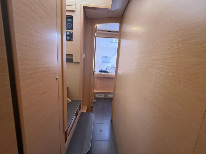 La Mer Yacht Photos Pics Interior hallway of 2020 Lagoon 42 yacht with wooden paneling and modern design.