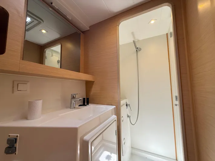 La Mer Yacht Photos Pics Modern bathroom interior on 2020 Lagoon 42 yacht, featuring sink and shower.