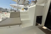 Interior view of 2020 Lagoon 42 catamaran with seating and steps.