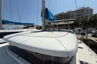 2020 Lagoon 42 catamaran docked, featuring Sunsail branding and modern design elements.