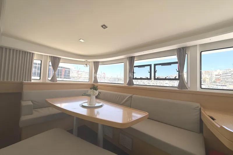 La Mer Yacht Photos Pics Interior of 2020 Lagoon 42 catamaran with spacious seating and large windows.