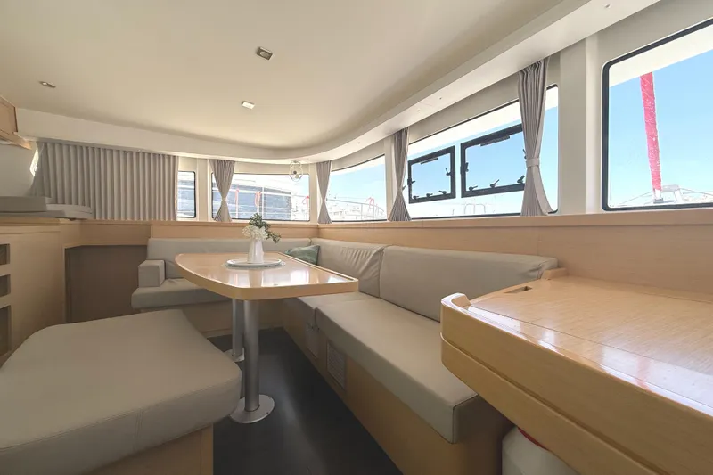 La Mer Yacht Photos Pics Interior of 2020 Lagoon 42 catamaran with modern seating and large windows.