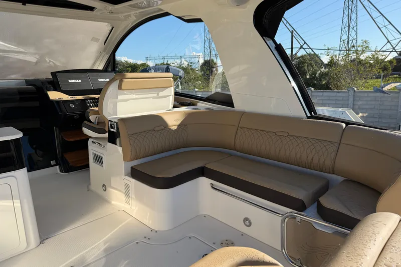  Yacht Photos Pics 2023 Sea Ray Sundancer 370 Outboard interior with luxurious seating and modern dashboard.