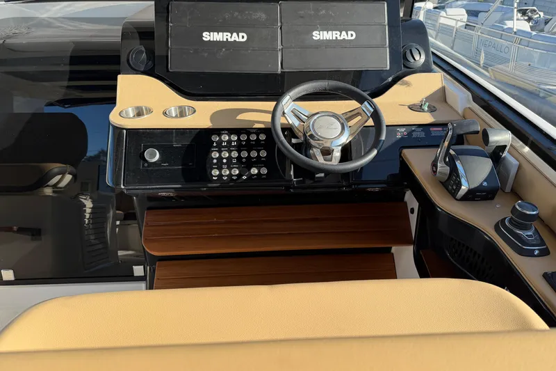 Yacht Photos Pics 2023 Sea Ray Sundancer 370 Outboard helm with Simrad displays and modern controls.