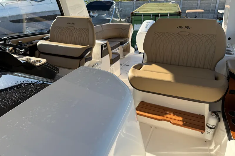  Yacht Photos Pics 2023 Sea Ray Sundancer 370 Outboard interior with beige seating and modern design.
