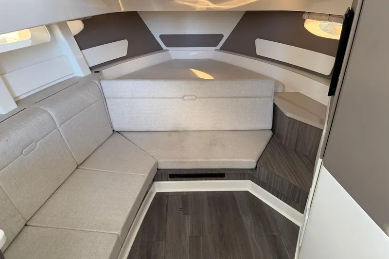  Yacht Photos Pics 2023 Sea Ray Sundancer 370 Outboard cabin interior with modern seating and wood flooring.