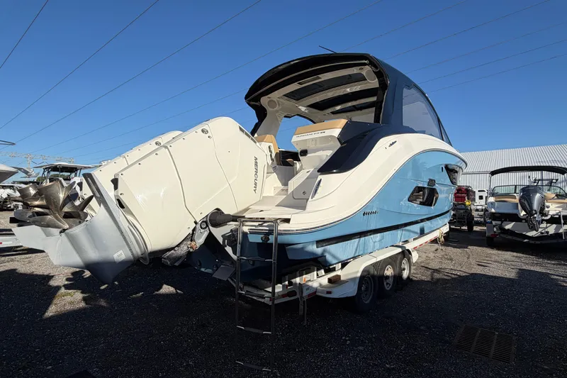  Yacht Photos Pics 2023 Sea Ray Sundancer 370 Outboard boat with powerful Mercury engines, parked on a trailer.