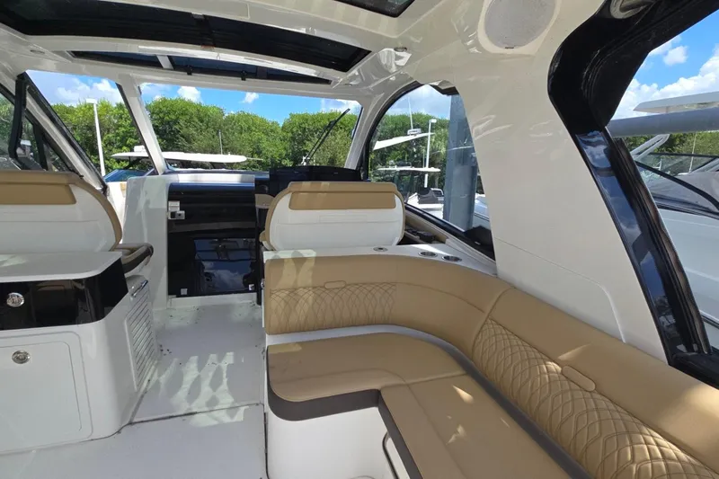  Yacht Photos Pics Luxurious interior of 2023 Sea Ray Sundancer 370 Outboard with elegant seating and modern design.