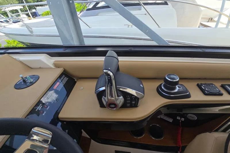  Yacht Photos Pics 2023 Sea Ray Sundancer 370 Outboard helm with controls and navigation equipment.