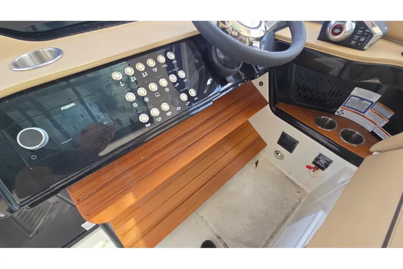  Yacht Photos Pics 2023 Sea Ray Sundancer 370 Outboard helm with control panel and wooden accents.