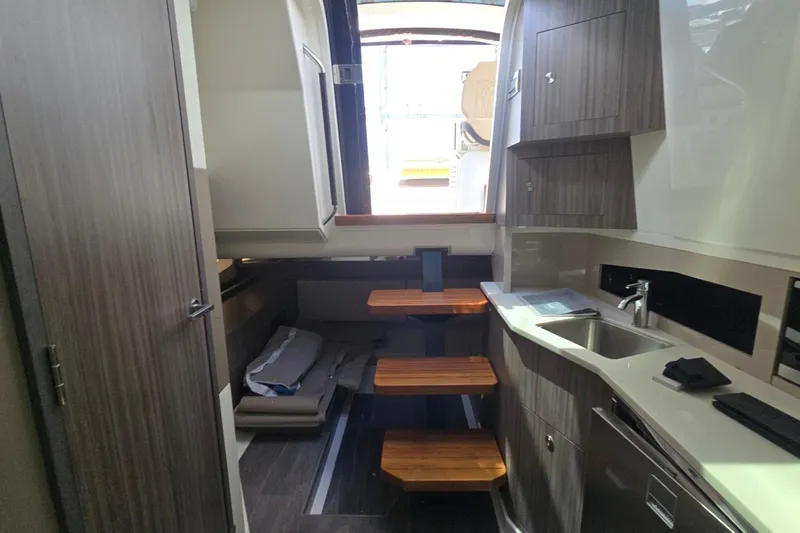  Yacht Photos Pics 2023 Sea Ray Sundancer 370 Outboard interior with modern kitchen and seating area.