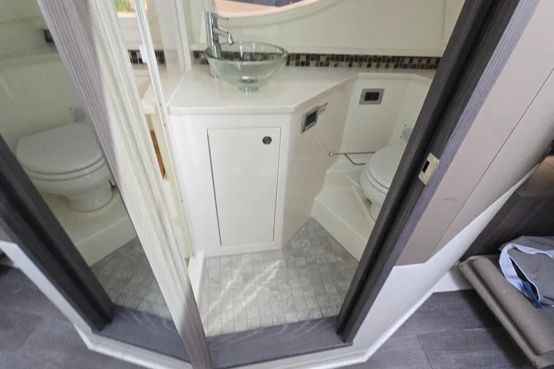  Yacht Photos Pics 2023 Sea Ray Sundancer 370 Outboard bathroom with modern sink and toilet.