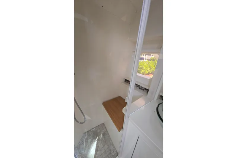  Yacht Photos Pics 2023 Sea Ray Sundancer 370 Outboard interior bathroom with modern design and natural light.