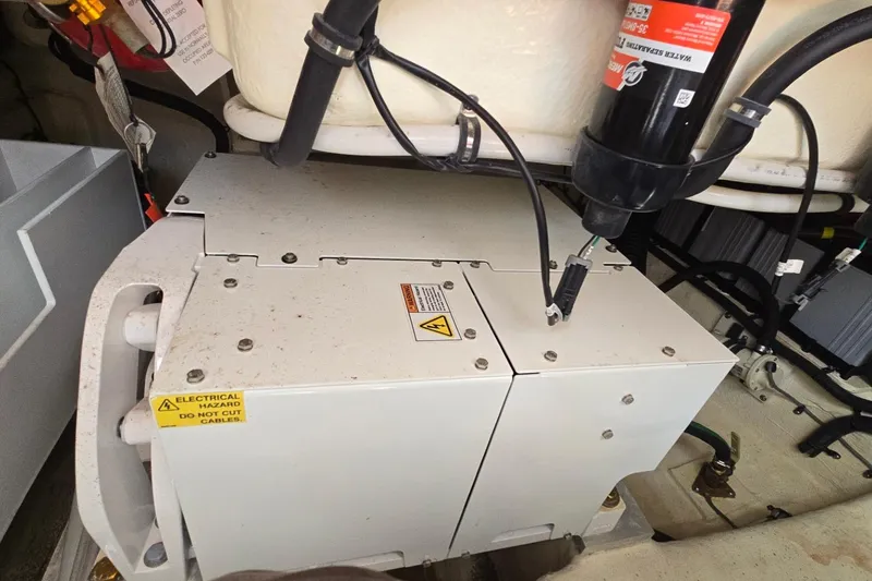  Yacht Photos Pics Engine compartment of 2023 Sea Ray Sundancer 370 Outboard with electrical hazard warning.