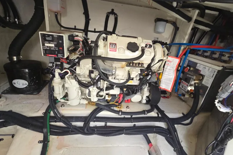  Yacht Photos Pics Engine compartment of 2023 Sea Ray Sundancer 370 Outboard with complex wiring and components.