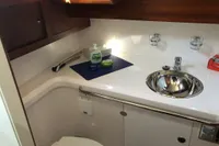Bathroom interior of 2007 Nimbus 380 Commander yacht, featuring sink and toilet.