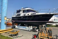 2007 Nimbus 380 Commander yacht on a trailer at a boatyard.
